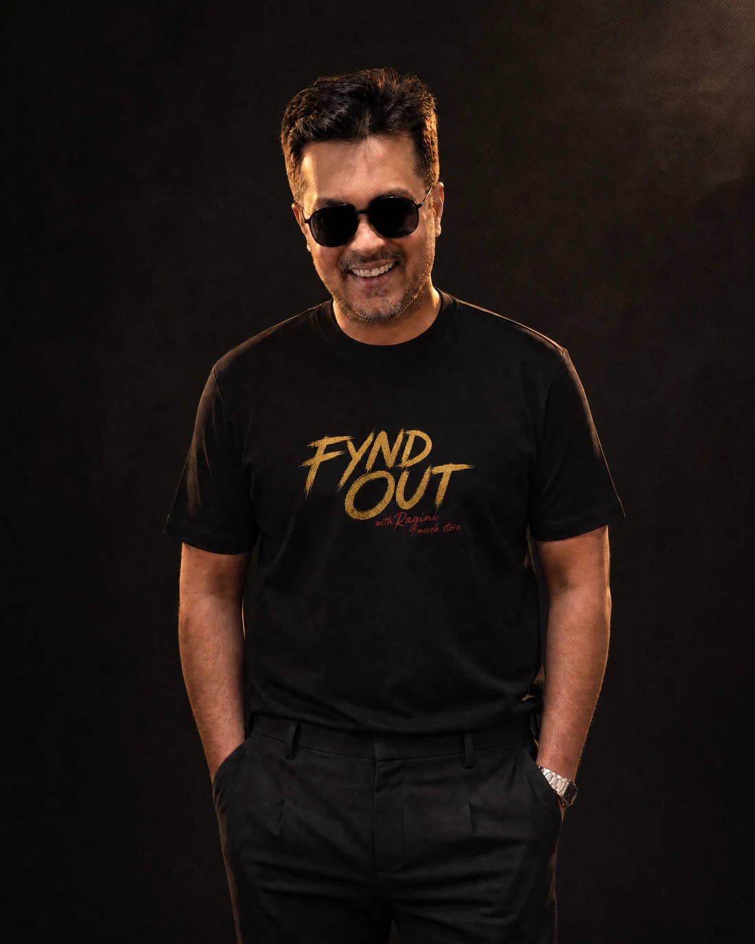 Farooq wearing the Men Original Fynd Out Wordmark Tee with the original FYND OUT with Ragini merch-store wordmark printed into the garment.