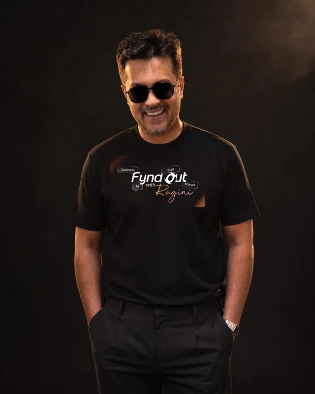 Farooq wearing the Men Fynd Out Primary Logo Tee with the approved Fynd Out with Ragini logo.