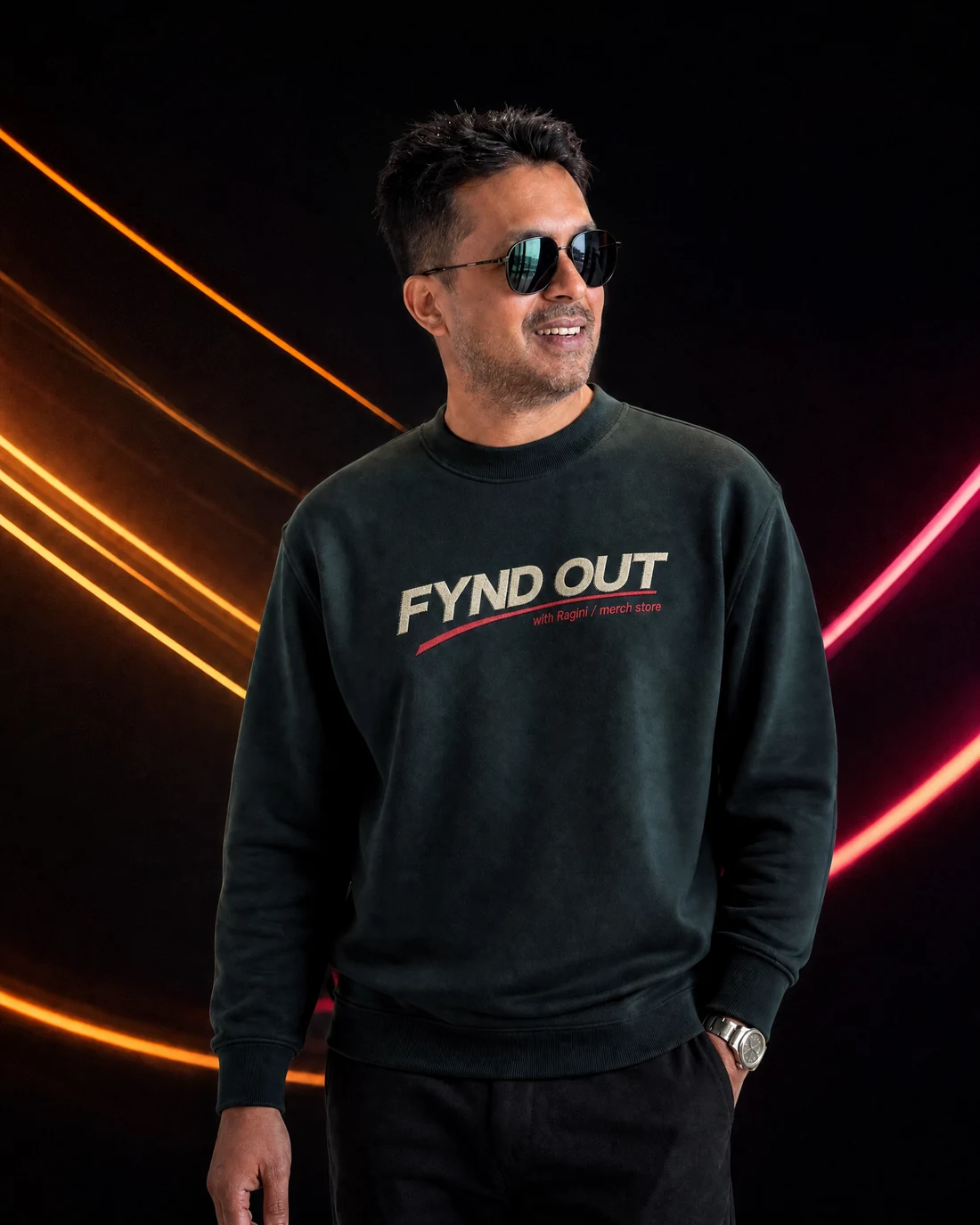 Farooq wearing the Men Tonal Fynd Out Wordmark Sweatshirt with the original FYND OUT with Ragini merch-store wordmark printed into the garment.