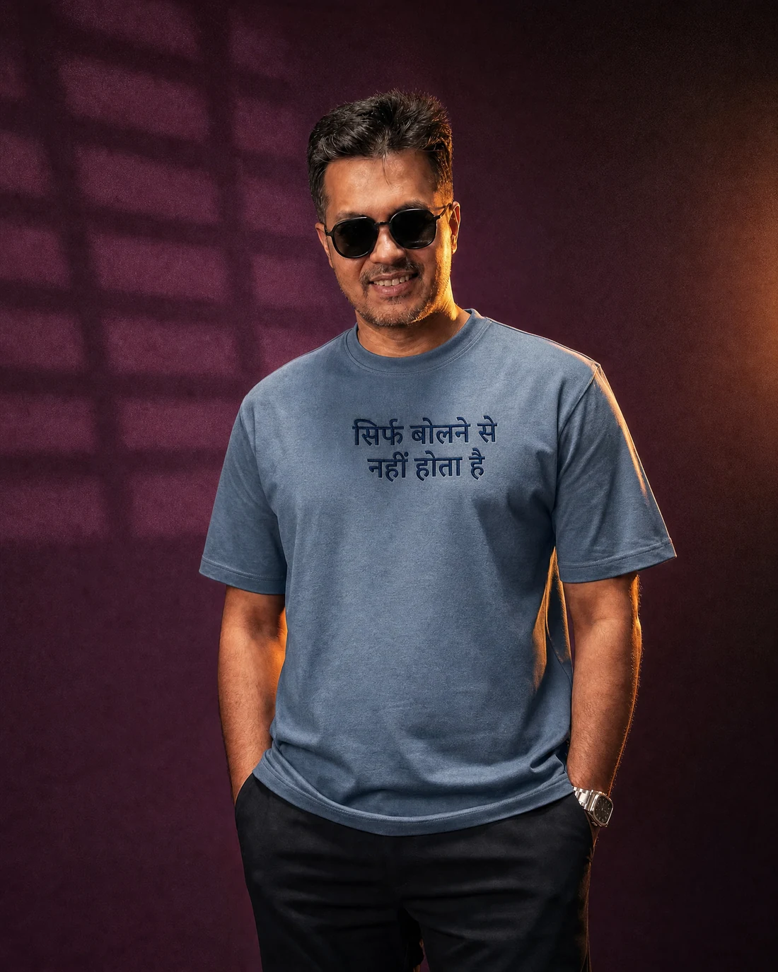 Farooq wearing the Men सिर्फ बोलने से नहीं होता है Editor’s Mark with the exact statement “सिर्फ बोलने से नहीं होता है” printed into the garment.