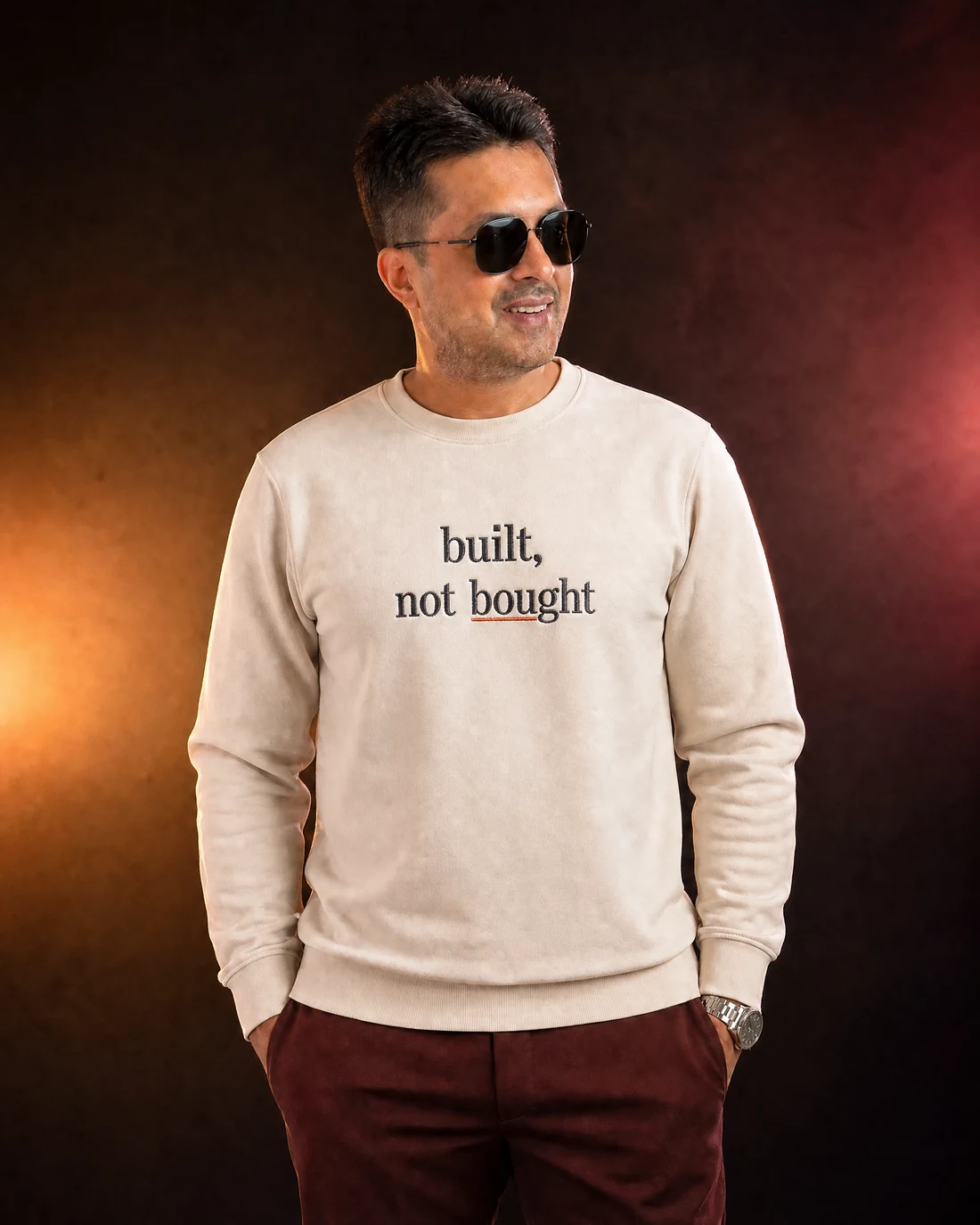 Farooq wearing the Men Built Not Bought Panel Drop with the exact statement “built, not bought” printed into the garment.