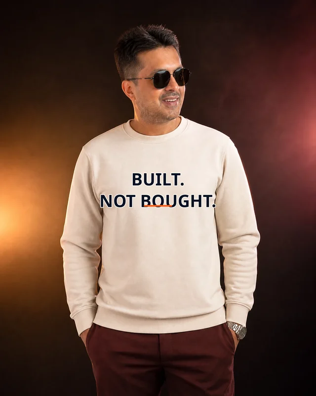 Farooq wearing the Men Built Not Bought Panel Drop featuring the exact statement “built, not bought”.