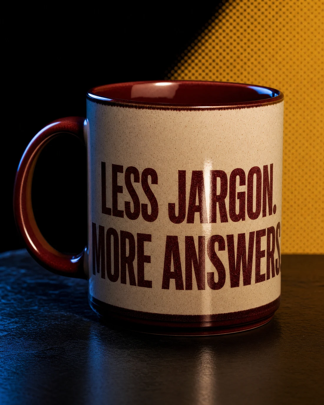 Fine porcelain mug photographed as a real premium object with the exact statement “less jargon. more answers.” integrated into its material.