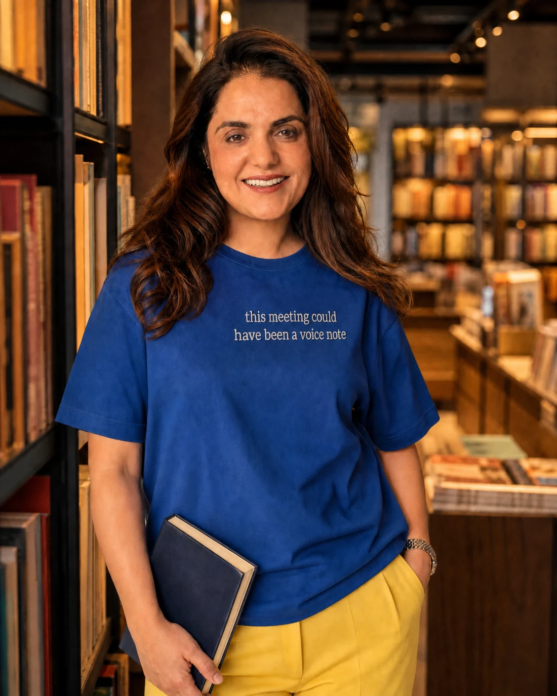 Ragini wearing the Women This Meeting Could Have Been A Editor’s Mark with the exact statement “this meeting could have been a voice note” printed into the garment.