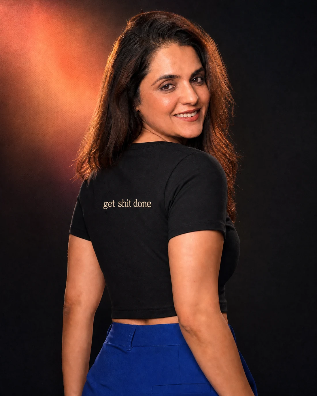 Ragini wearing the Women Get Shit Done Backstory with the exact statement “get shit done” printed into the garment.